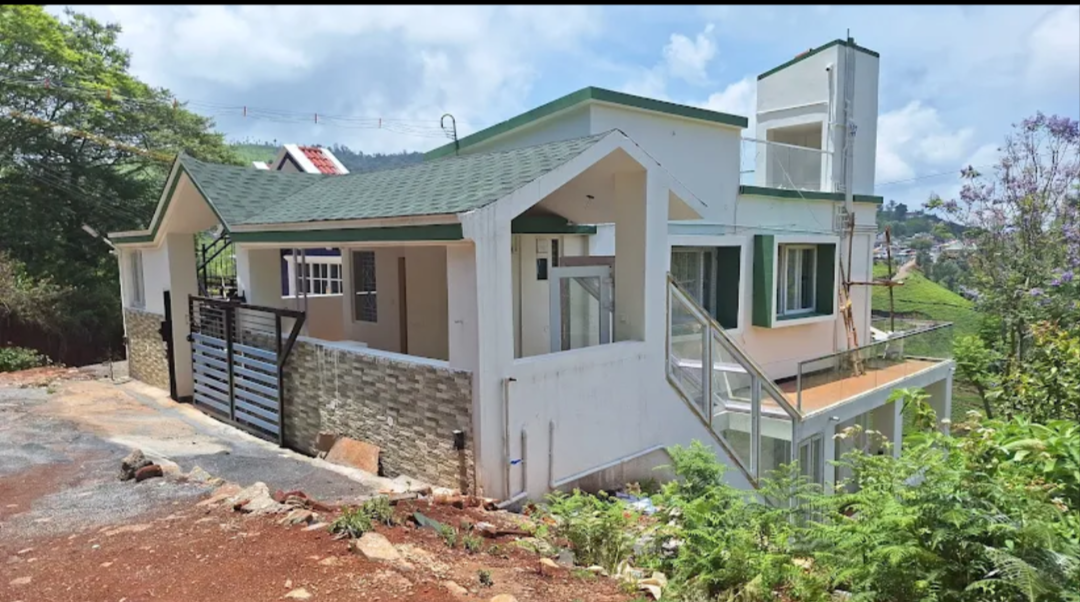 Modern hill bungalow with green sloped roof